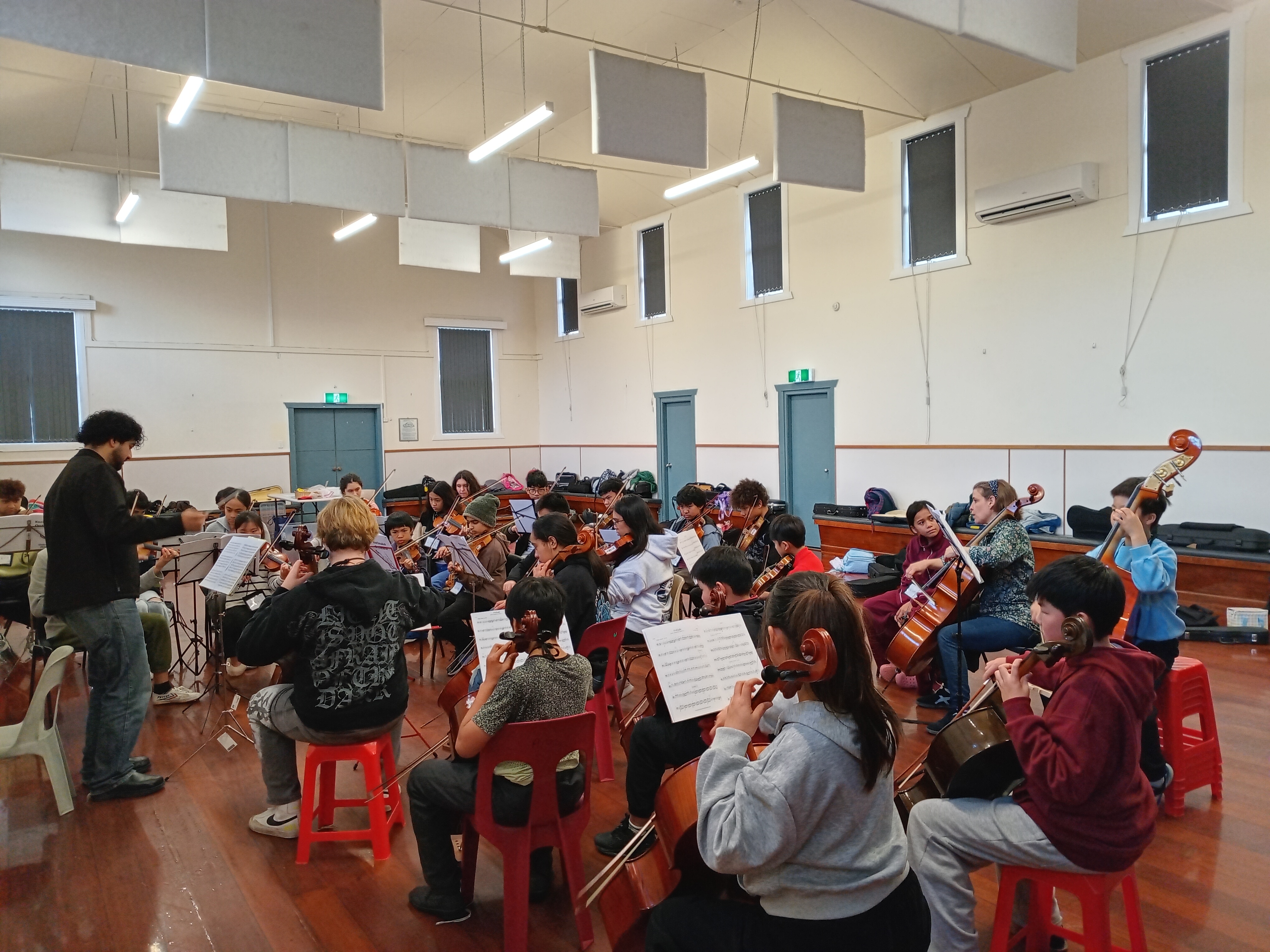 Arohanui Strings+ musicians gathered in the Avalon main hall